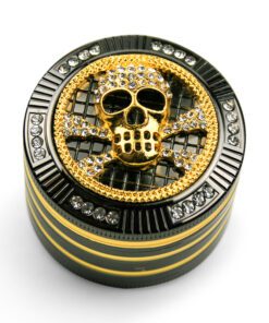 Skull grinder made of metal with diamond shaped glass and gold accents.