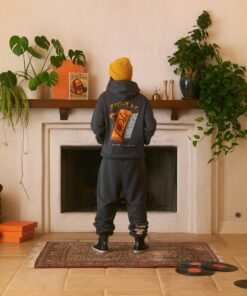 Guy wearing orange logo hoodie from Zig-Zag showing back side.